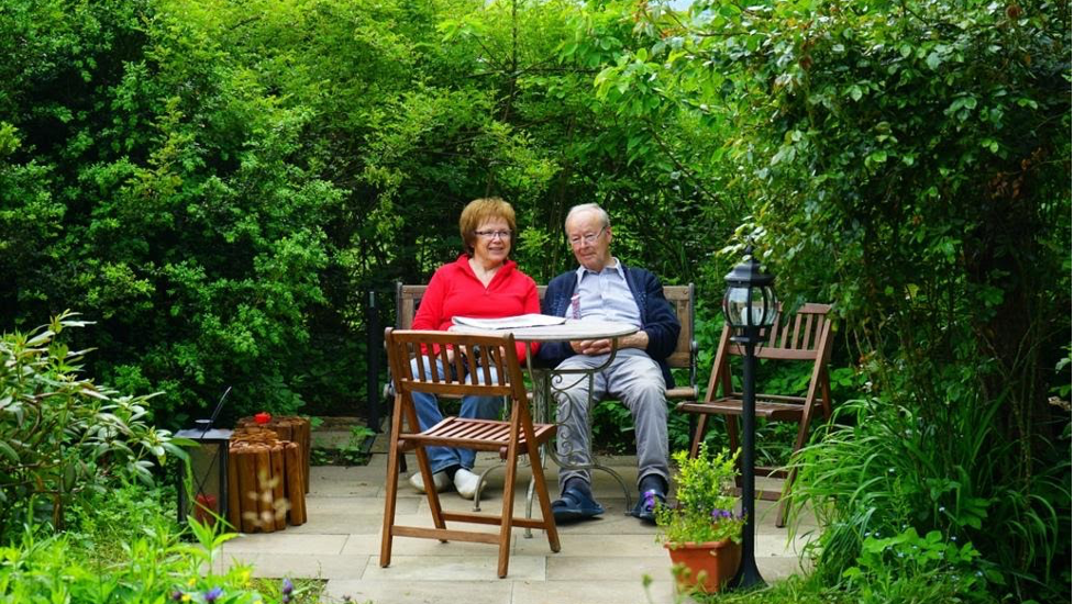 A small corner surrounded by greenery makes a nice sitting area in the garden. .  Photo: Pxhere