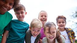 portrait-of-children-on-outdoor-activity-camping-t-372J5M4