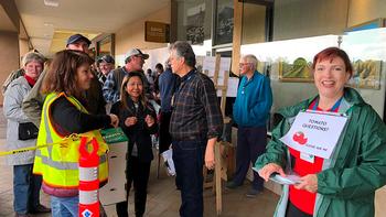Customers happily line up at the UC Marin Master Gardeners Tomato Market  Photo: UCANR