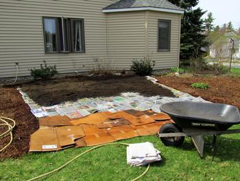 Sheet mulching is an easy, low-cost way to snuff out weeds or lawn and improve soil. Plants should not be within 5 feet of the home. Photo: mwms1916