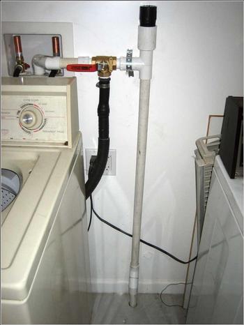 Simple DIY connections can be made to your washer to direct graywater to your landscape. Photo: UC Master Gardeners, SLO County, CA