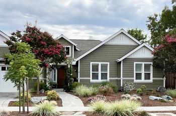 The soil in this garden is protected with diverse ornamental plants that grow year-round, and fir bark mulch. Consider fire-safe landscaping tips.